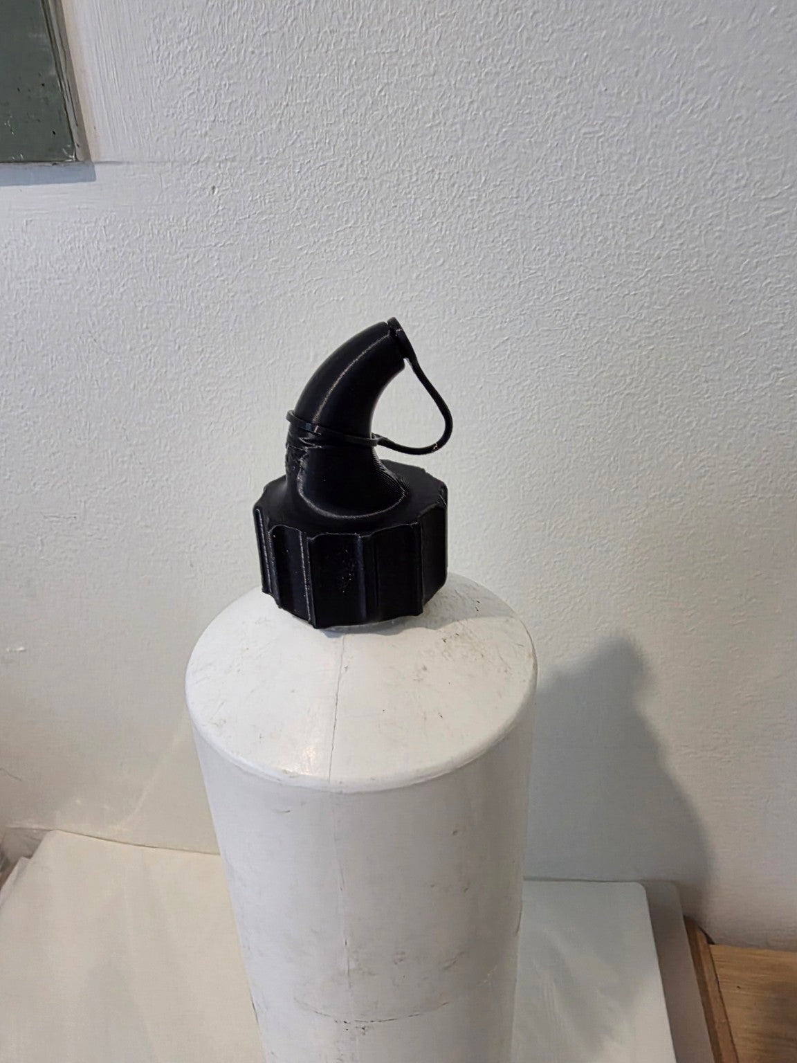 Commercial toilet cleaner nozzle fitted to bottle
